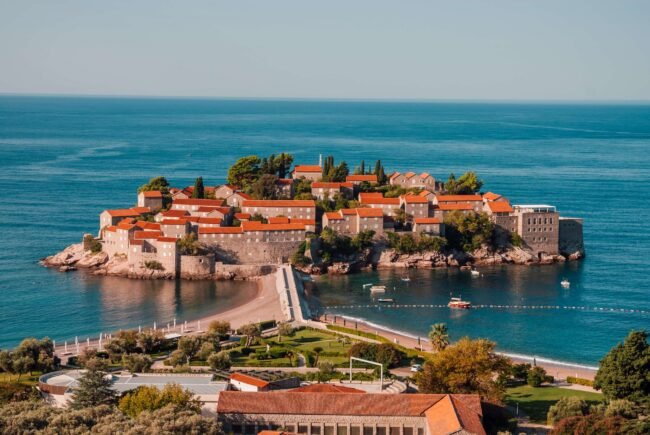 Sveti Stefan Montenegro iconic island peninsula with terracotta-roofed stone buildings connected to the Adriatic coastline 